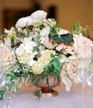 Textured Floral Arrangement
Photography: Erika Delgado Photography
Read More:
http://www.insideweddings.com/weddings/modern-chic-wedding-with-rustic-touches-and-copper-details/1129/ small textured centerpieces with variety of ivory florals and greenery