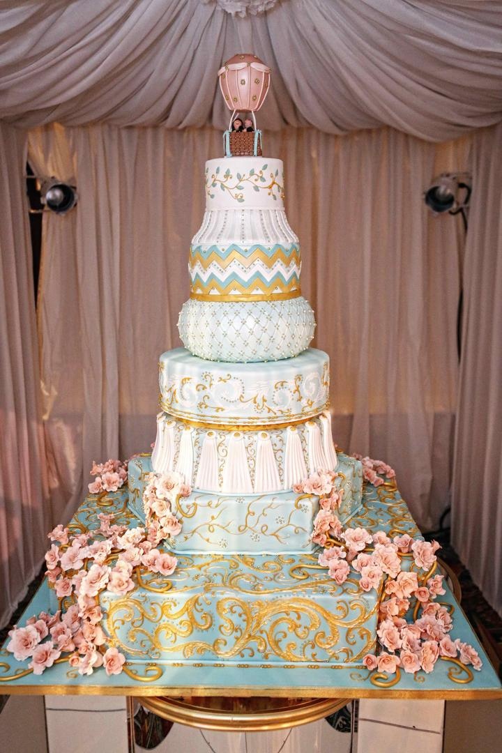 Wedding Cake
Photography: Tomas Ramos Photographers
Read More:
http://www.insideweddings.com/weddings/houston-indian-wedding-celebration-with-800-person-guest-list/435/ Wedding cake with blue and white tiers with different