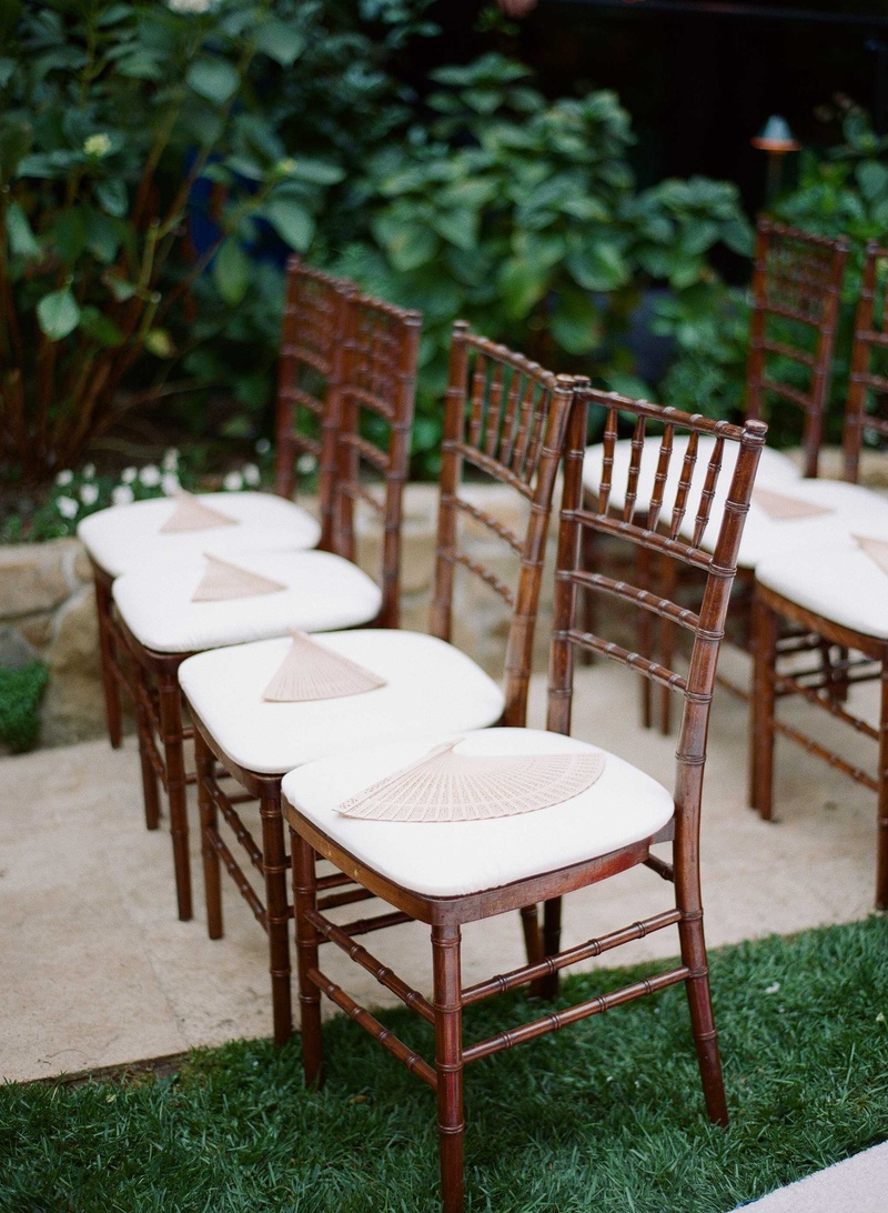 Fans On Top of Ceremony Chairs
Photography: Mi Belle Photographers
Read More:
http://www.insideweddings.com/weddings/colorful-outdoor-wedding-with-supper-club-theme-in-los-angeles-ca/741/ Wedding chairs on Hotel Bel-Air Swan Lake lawn with wood fans