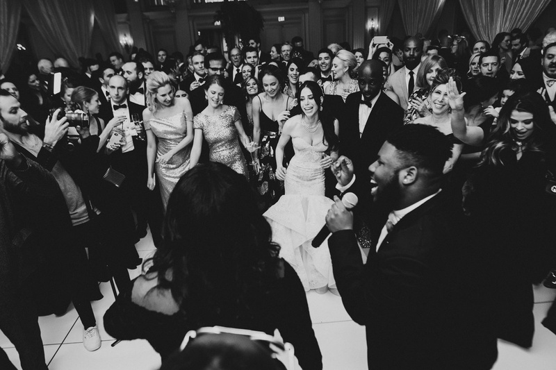 Packed Dance Floor at Wedding
Photography: Mantas Kubilinskas Photography
Read More:
http://www.insideweddings.com/weddings/sophisticated-ceremony-ballroom-reception-in-washington-dc/1296/ black and white photo of live band singing and performing at wedding reception guests on dance floor