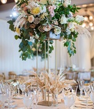 Tall Centerpiece on Gold Four-Post Riser
Photography: Kiss Me in Paris
Read More:
http://www.insideweddings.com/weddings/ocean-view-ceremony-romantic-reception-with-chic-coastal-elements/1190/ tall centerpiece gold riser greenery scabiosa pods grass variety dahlia rose flowers