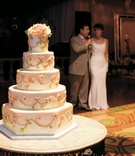 Wedding Cake
Photography: Denis Reggie Photographers
Read More:
http://www.insideweddings.com/weddings/sophisticated-tented-farm-wedding-in-northern-california/211/ Wedding cake with golden swirls and light green beading