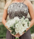 White Bridesmaid Bouquet with Greens
Photography: Shaun Menary Photography
Read More:
http://www.insideweddings.com/weddings/outdoor-elements-in-lavish-modern-wedding-of-childhood-sweethearts/802/ Bridesmaid bouquet with white flowers and greenery grey beaded dress
