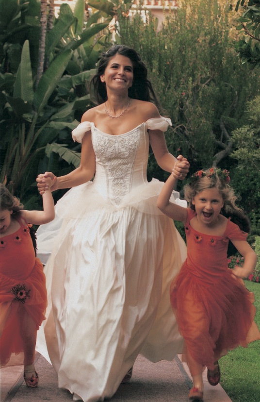 Bride and Flower Girls Wearing Orange Dresses
Photography: Simone %26 Martin Photography
Read More:
http://www.insideweddings.com/weddings/a-midsummer-nights-dream-wedding-in-beverly-hills-california/58/ bride holds hands and runs with flower girls