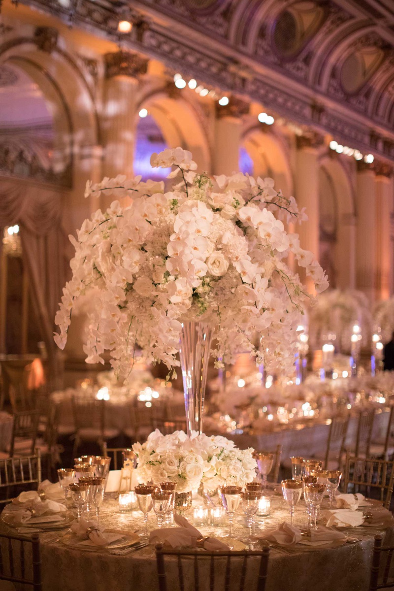 Orchid, Rose %26 Hydrangea Flower Arrangement
Photography: The Day by Ira Lippke
Read More:
http://www.insideweddings.com/weddings/opulent-luxury-wedding-with-timeless-color-palette-in-new-york-city/1199/ wedding reception rount table tall centerpiece orchid rose hydrangea flowers gold rim glassware