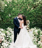 Abby Brown %26 Benjamin Rosenzweig
Photography: Valorie Darling Photography
Read More:
http://www.insideweddings.com/weddings/spring-garden-wedding-ceremony-luxury-reception-in-beverly-hills/1379/ bride in vera wang wedding dress with bow in back kissing groom in tuxedo at four seasons ceremony