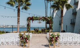 Ceremony Overlooking Water
Photography: EDLT Photo
Read More:
http://www.insideweddings.com/weddings/ocean-view-ceremony-featuring-modern-decor-with-a-tropical-twist/1222/ long beach wedding, ceremony arch between two palm trees, fall wedding color scheme