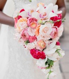 Pink %26 Coral Cascading Bouquet
Photography: Milanés Photography
Read More:
http://www.insideweddings.com/weddings/opulent-ballroom-wedding-with-coral-gold-color-palette-in-atlanta/1240/ cascading bouquet with pink, peach, orange, white roses, orchids, hot pink cockscomb celosia flowers