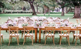 Long Wood Reception Table %26 Chairs
Photography: Petula Pea Photography
Read More:
http://www.insideweddings.com/weddings/romantic-outdoor-hawaiian-destination-wedding-with-lilac-details/1221/ wedding reception outdoor hawaii string lights long wood table vineyard chairs low centerpieces