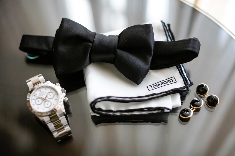 Groom's Bow Tie, Watch %26 Cuff Links
Photography: Samuel Lippke Studios
Read More:
http://www.insideweddings.com/weddings/romantic-jewish-wedding-with-lush-ivory-flowers-rose-gold-details/790/ Tom Ford white pocket square with black border, black bow tie, silver watch, black cufflinks