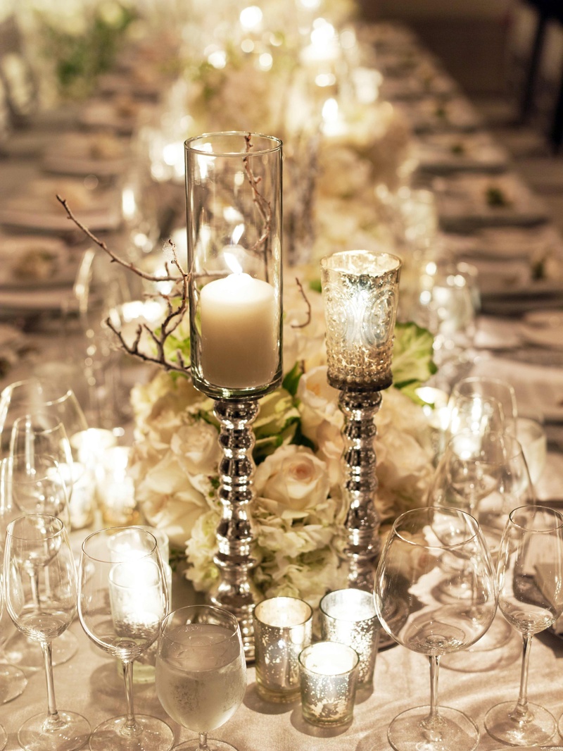 Glass Candlesticks
Photography: Cooper Carras Photography
Read More:
http://www.insideweddings.com/weddings/classic-winter-white-wedding-in-wine-country/417/ Mercury-glass votive candle holders
