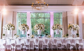 Head Table with White Décor
Photography: Vue Photography
Read More:
http://www.insideweddings.com/weddings/a-wedding-planners-personalized-celebration-at-a-historic-mansion/824/ Head table with white chairs, white linen, lucite risers, white ginger jar centerpieces, flowers
