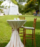 Cocktail Hour
Photography: LiquidLightImages Photography
Read More:
http://www.insideweddings.com/weddings/michelle-raab-and-angus-mitchell/351/ Outdoor wedding cocktail hour with table covered in white tablecloth is surrounded by wood chairs