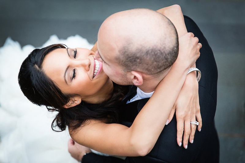 Beaming Bride Embraces Groom
Photography: Danette Pascarella Photography
Read More:
http://www.insideweddings.com/weddings/catholic-ceremony-estate-reception-with-travel-themed-details/696/ Happy bride in Lazaro gown hugs groom in black tuxedo