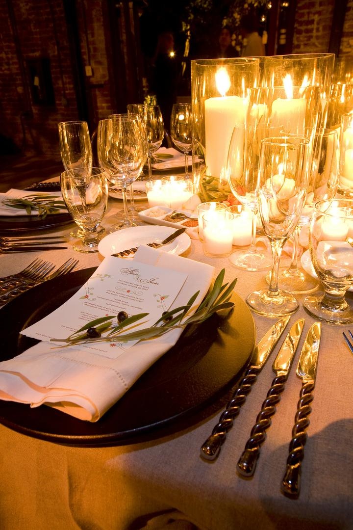 Candlelit Olive Branch Place Setting
Photography: Simone %26 Martin Photography
Read More:
http://www.insideweddings.com/weddings/sophisticated-autumn-inspired-wedding-in-napa-valley-california/262/ Wedding reception table covered with candles