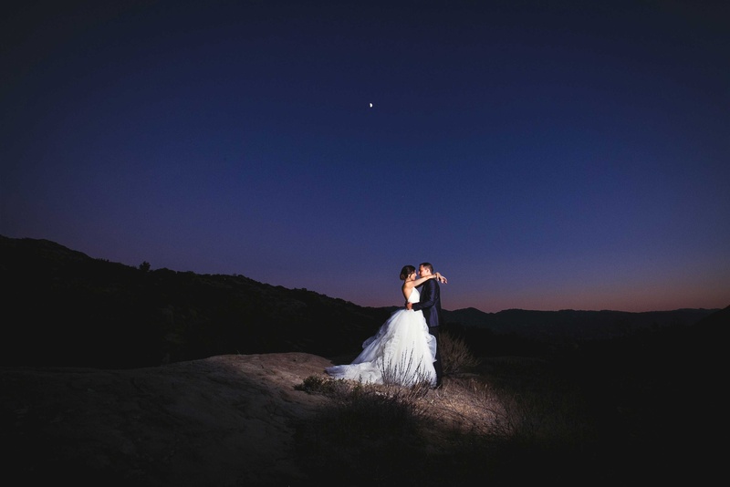Bride and Groom Embrace in Dark Outdoor Space
Photography: Callaway Gable
Read More:
http://www.insideweddings.com/weddings/alfresco-summer-wedding-with-lush-foliage-accents-in-california/805/ newlywed bride and groom embracing during night reception in outdoor space southern california