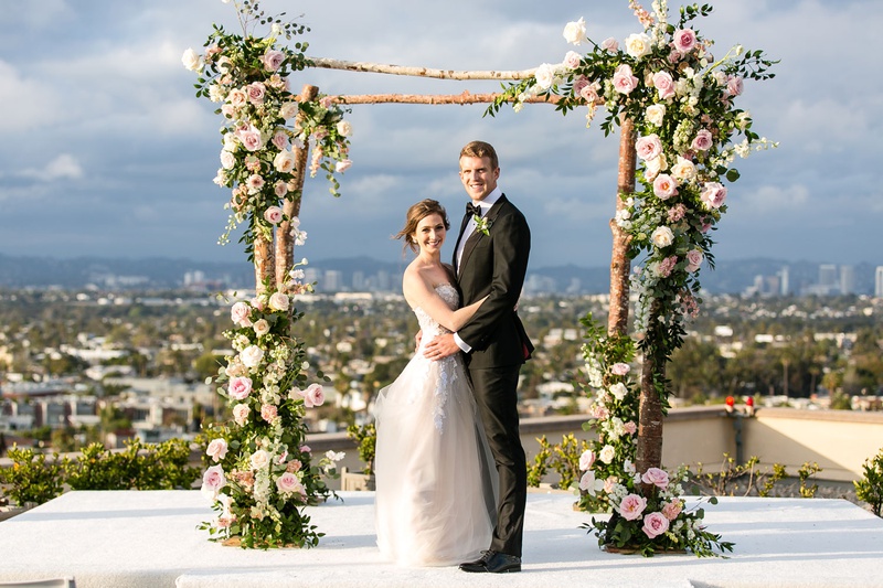 Bride %26 Groom Under Rustic Chuppah
Photography: Aevitas Weddings
Read More:
http://www.insideweddings.com/weddings/rooftop-ceremony-ballroom-reception-with-english-garden-theme/1286/ wedding ceremony on rooftop overlooking los angeles bride in strapless wedding dress with tall groom