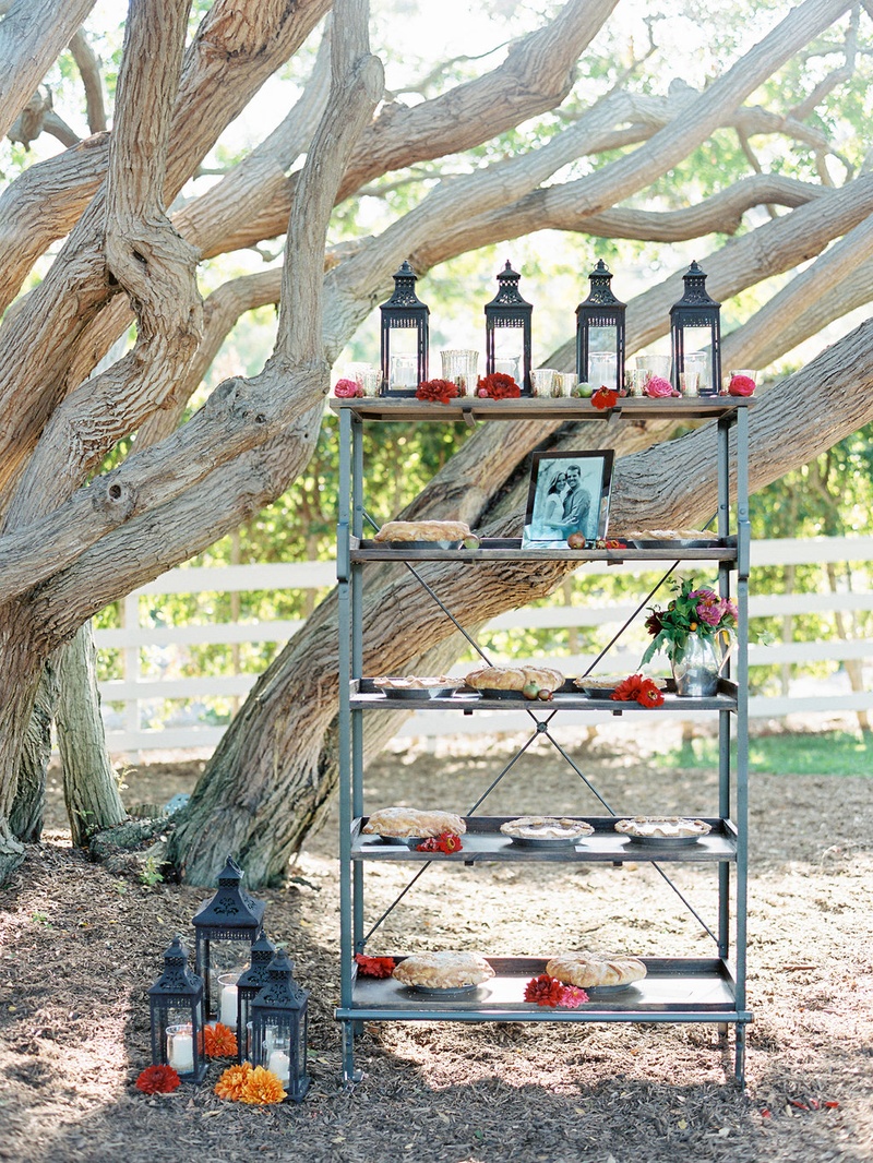 Wedding Pie Station on Tall Shelf
Photography: Ryan Ray Photography
Read More:
http://www.insideweddings.com/weddings/outdoor-wedding-with-vibrant-pink-orange-decor-in-california/723/ Outdoor wedding with shelving unit and pies decorated with Moroccan lanterns