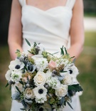 Bride in Dress Holding Winter Bouquet
Photography: Chris Bailey Photography
Read More:
http://www.insideweddings.com/weddings/sophisticated-southern-soiree-in-texas-with-an-ode-to-new-orleans/1093/ Winter Bridal Bouquet white anemone flowers with blue centers, brunia balls, pink and white roses