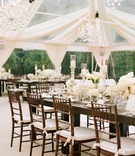 White Tent Wedding
Photography: Elizabeth Messina
Read More:
http://www.insideweddings.com/weddings/georgetown-cupcake-cofounder-katherine-kallinis-california-wedding/405/ Wood reception tables with white flower centerpieces