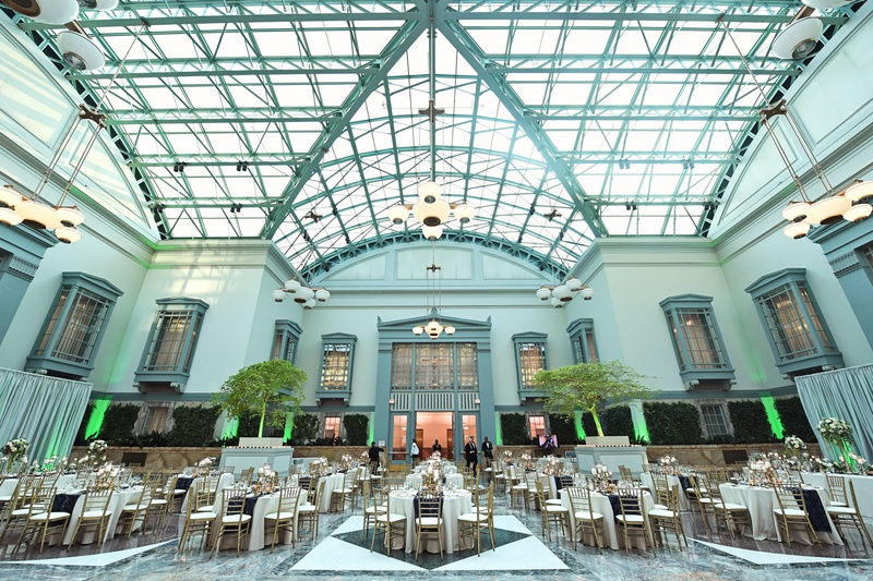 Wedding Reception at Chicago Library
Photography: Carasco Photography
Read More:
http://www.insideweddings.com/weddings/personalized-fairy-tale-wedding-with-fun-entertainment-in-chicago/1283/ Harold Washington Library wedding reception skylight neutral decor blue runner gold details gay lgbt
