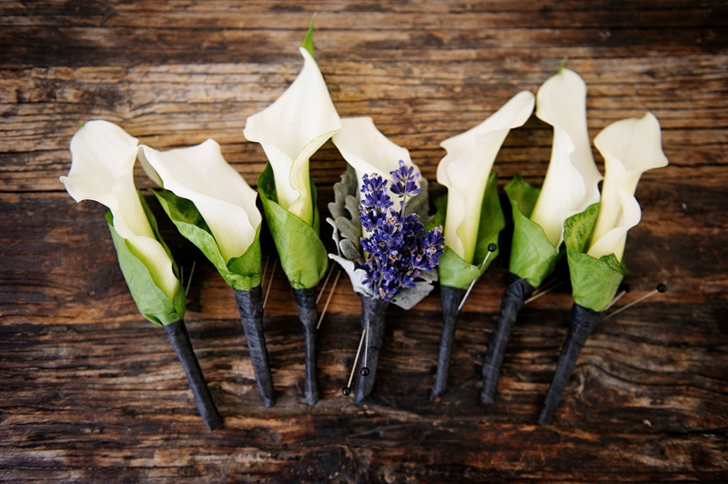 Ivory Calla Lily Boutonnieres
Photography: Next Exit Photography
Read More:
http://www.insideweddings.com/weddings/alfresco-interfaith-ceremony-ballroom-reception-in-santa-monica/963/ Groomsmen boutonniere white calla lily with green casing purple lavender for groom