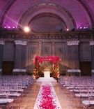 Historical Wedding Ceremony Venue Décor
Photography: Heather Waraksa
Read More:
http://www.insideweddings.com/weddings/summer-wedding-with-vibrant-color-palette-in-brooklyn-new-york/738/ Clear chiavari chairs at Weylin B. Seymour's venue with floral chuppah and flower petal aisle