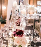 Tall Clear Candleholders %26 Low Flowers
Photography: Artistrie Co.
Read More:
http://www.insideweddings.com/weddings/rustic-elegant-celebration-with-personalized-elements-in-chicago/1026/ Rectangle reception table with low rose and purple centerpieces tall clear candleholders acrylic