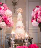 Tall Cake with Monogram and Flowers
Photography: John Cain Photography
Read More:
http://www.insideweddings.com/weddings/classic-wedding-with-personalized-details-and-a-pink-gold-palette/1345/ wedding reception ballroom white pink ivory cake fresh flowers monogram on mirror table
