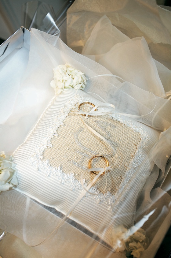 Monogrammed Ring Pillow
Photography: Gruber Photographers
Read More:
http://www.insideweddings.com/weddings/english-garden-inspired-fall-wedding-in-new-york-city/210/ White and ivory cushion with rings on ribbon