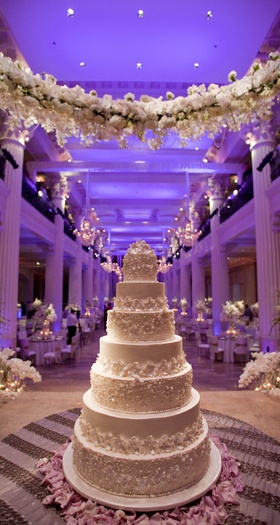 Floral-Embellished Cake
Photography: Michael Carr Photography
Read More:
http://www.insideweddings.com/weddings/exceptional-wedding-event-in-historical-houston-building/468/ White wedding cake under garland of white flowers