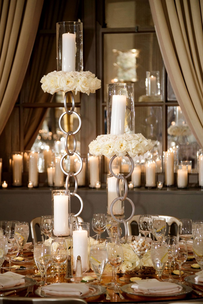 Chain-Link Candlesticks
Photography: Bob %26 Dawn Davis Photography
Read More:
http://www.insideweddings.com/weddings/modern-glamorous-jewish-wedding-with-unique-decor-in-chicago/1154/ Wedding reception unique modern decor rose gold mirror table with chain candleholder pillar candles