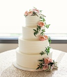 Fresh Garden Roses on Wedding Cake
Photography: Laurie Bailey Photography
Read More:
http://www.insideweddings.com/weddings/oceanfront-wedding-ceremony-classic-romantic-ballroom-reception/854/ four tiered wedding cake with buttercream frosting, blush garden roses, greenery