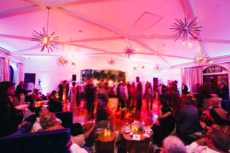 Guests Dancing in Club-Theme Ballroom
Photography: Mi Belle Photographers
Read More:
http://www.insideweddings.com/weddings/colorful-outdoor-wedding-with-supper-club-theme-in-los-angeles-ca/741/ Supper club theme wedding reception with guests on dance floor under retro style light fixtures