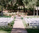White Ceremony Chairs & Fountain