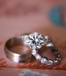 Round Diamond Ring and Wedding Band
Photography: Samuel Lippke Studios
Read More:
http://www.insideweddings.com/weddings/elegant-alfresco-ceremony-ballroom-reception-in-dallas-texas/930/ Solitaire diamond engagement ring with diamonds on setting and men's wedding band with rose gold