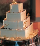 White Wedding Cake With Gold Leaf
Photography: Dalal Photography
Read More:
http://www.insideweddings.com/weddings/old-world-elegance-at-classic-ballroom-wedding-in-san-francisco/85/ square white cake decorated with gold leaves
