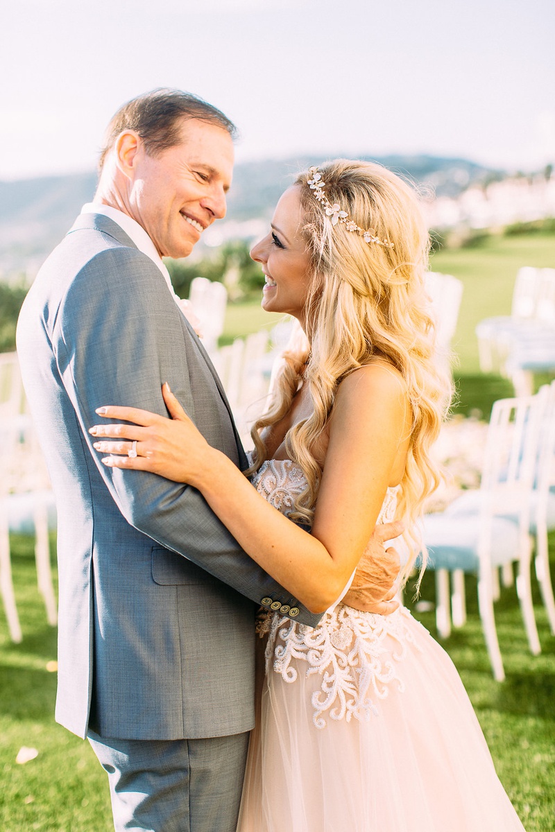 Bride in Blush-Toned Gown with Groom
Photography: Ashley Paige Photography
Read More:
http://www.insideweddings.com/weddings/romantic-ocean-view-ceremony-charming-reception-in-california/1337/ bride in custom trish peng wedding dress blush undertones grey suit for groom ceremony portrait