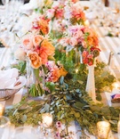 Peach and Pink Centerpiece
Photography: Sharayamauck Photography
Read More:
http://www.insideweddings.com/weddings/an-artistic-fall-wedding-at-a-rustic-lodge-in-kansas/607/ peach and pink flowers and greenery down center of table
