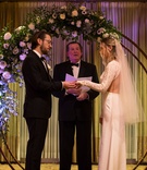 Circular Floral Altar
Photography: Green Vintage Photography
Read More:
http://www.insideweddings.com/weddings/modern-country-club-wedding-with-baseball-inspired-details/1043/ bride and groom exchange rings, circular wedding arch half covered with flowers and greenery