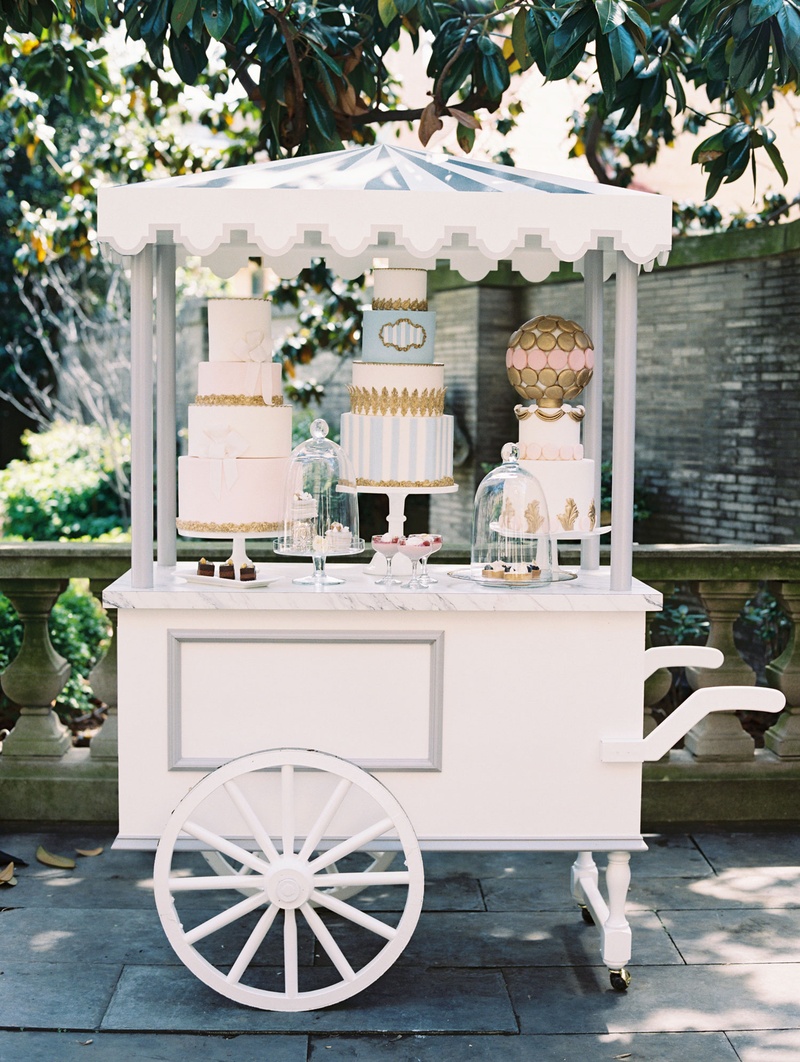 Custom Dessert Cart at Outdoor Wedding
Photography: Abby Jiu Photography
Read More:
http://www.insideweddings.com/weddings/chic-parisian-romance-inspired-spring-wedding-in-washington-dc/1038/ Wedding reception Paris theme dessert pastry cart with three cakes and macaron sphere with pastries