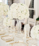 Hydrangeas and Roses
Photography: Brandon Chesbro
Read More:
http://www.insideweddings.com/weddings/classic-white-wedding-at-a-historic-estate-in-nashville/1219/ white and gold wedding decor, centerpieces with white hydrangeas and roses, tall centerpieces