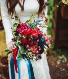 Wildflower Bridal Bouquet
Photography: Veronica Varos Photography
Read More:
http://www.insideweddings.com/weddings/a-bohemian-inspired-wedding-shoot-in-an-enchanted-forest/643/ Bride's bouquet of wildflowers in red, purple, blue colors and greenery wrapped with blue ribbons
