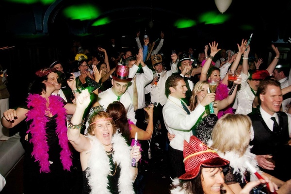 New Years Eve Party Guest ... New Year's Eve hat and feather boas · Guest celebration and toast at midnight ...