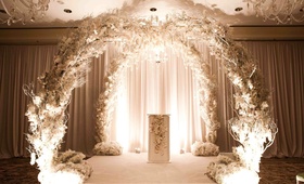 White Arch Ceremony Structure
Photography: Nancy Cohn Photography %26 Lauren and Abby Ross Weddings
Read More:
http://www.insideweddings.com/weddings/modern-wedding-with-black-white-elements/325/ White branch and flower arch for indoor wedding ceremony