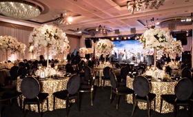 Black, White %26 Gold Party Décor
Photography: Laurie Bailey Photography
Read More:
http://www.insideweddings.com/weddings/50th-anniversary-party-a-surprise-vow-renewal-in-beverly-hills/1273/ ballroom anniversary party gold linen black gold chairs white flower arrangements chandelier stage