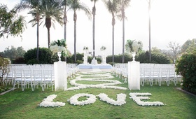 Stephanie Ming %26 Levine Toilolo's Ceremony
Photography: McCune Photography
Read More:
http://www.insideweddings.com/weddings/stephanie-ming-and-levine-toilolo/1067/ Grass lawn wedding ceremony white flowers and green leaves white flower petal swirl aisle love