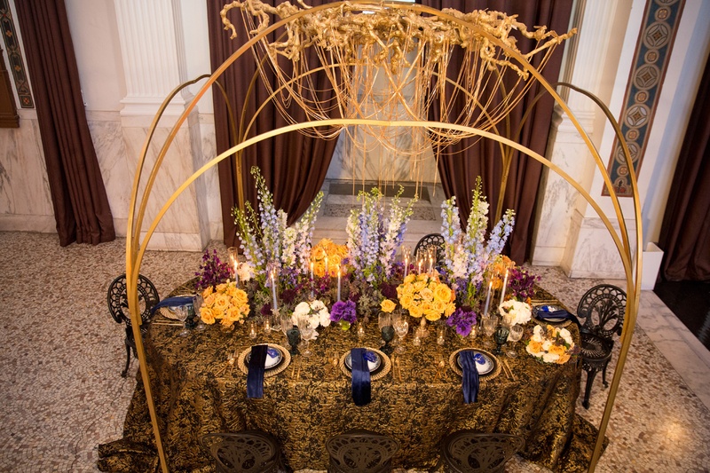 Bird's Eye View of Opulent Table
Photography: Duke Photography
Read More:
http://www.insideweddings.com/weddings/dramatic-tablescape-at-launch-party-for-luxe-linens-newest-line/987/ wedding styled shoot, golden chain chandelier, gold and black linen, colorful florals