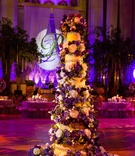 Floral-Embellished Cake
Photography: Davide DePas
Read More:
http://www.insideweddings.com/weddings/opulent-washington-dc-wedding-with-golden-details/547/ Tall six layer cake with purple and cream flowers