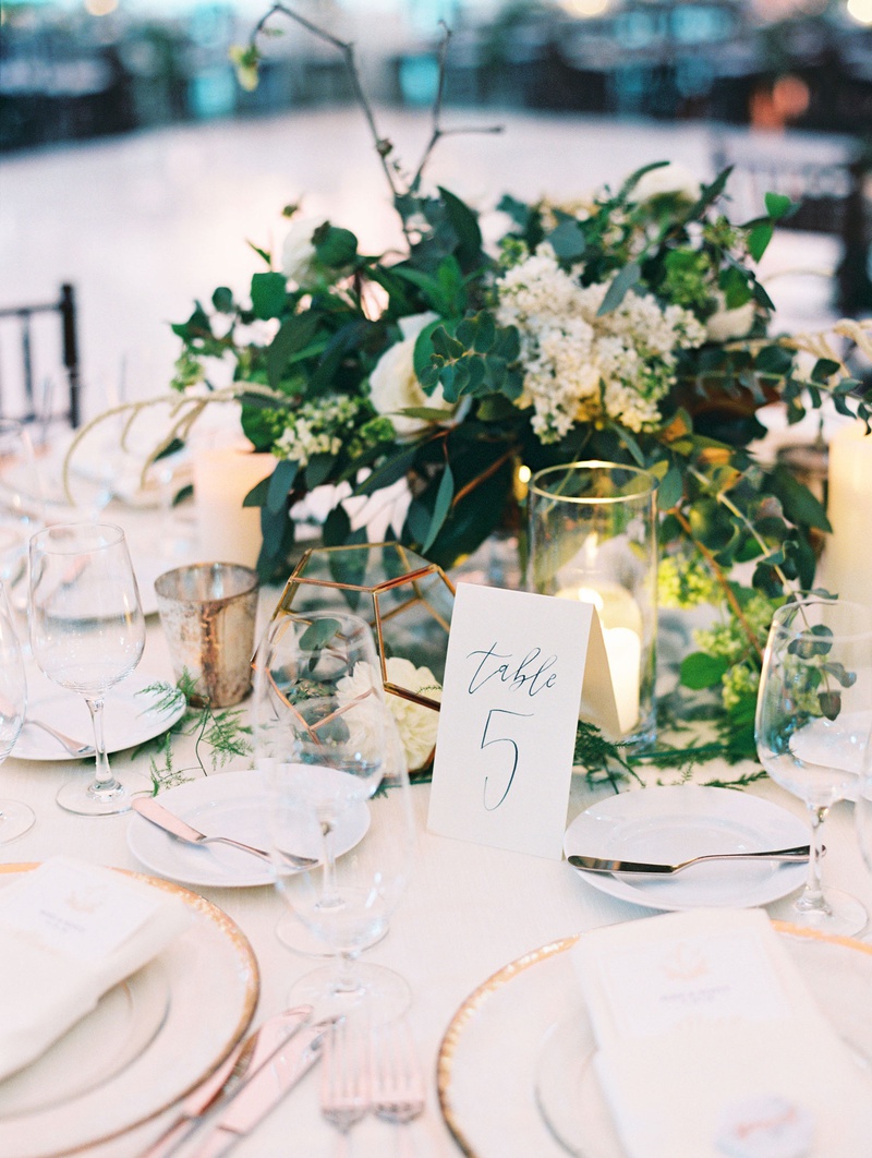 Gold Chargers %26 Centerpiece Accents
Photography: Mallory Dawn Photography
Read More:
http://www.insideweddings.com/weddings/outdoor-jewish-ceremony-luxe-reception-at-vibiana-in-downtown-la/1259/ wedding reception centerpiece greenery white flowers calligraphy table number gold terrarium candles
